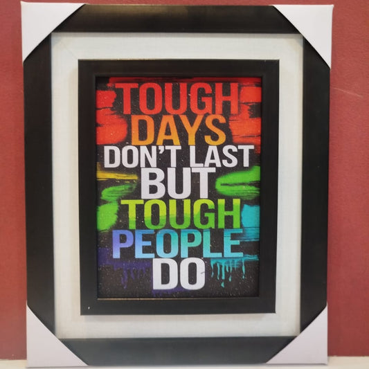 Framed motivational quote with colorful text on a black background